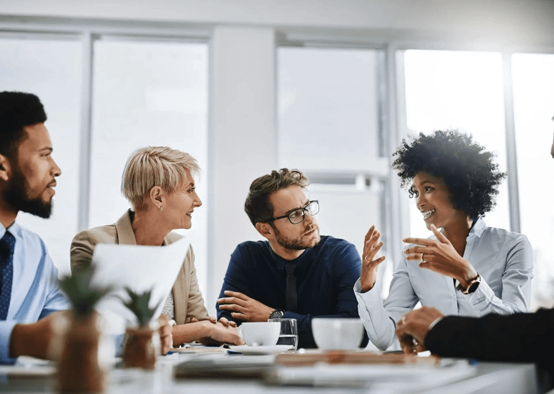 Young professionals collaborating and discussing ideas in a modern office.